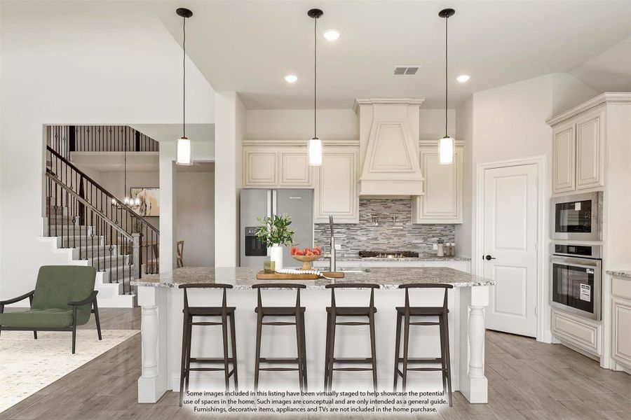 Kitchen with large granite island, four bar stools, cream cabinets, tile backsplash, and pendant lights above the island.