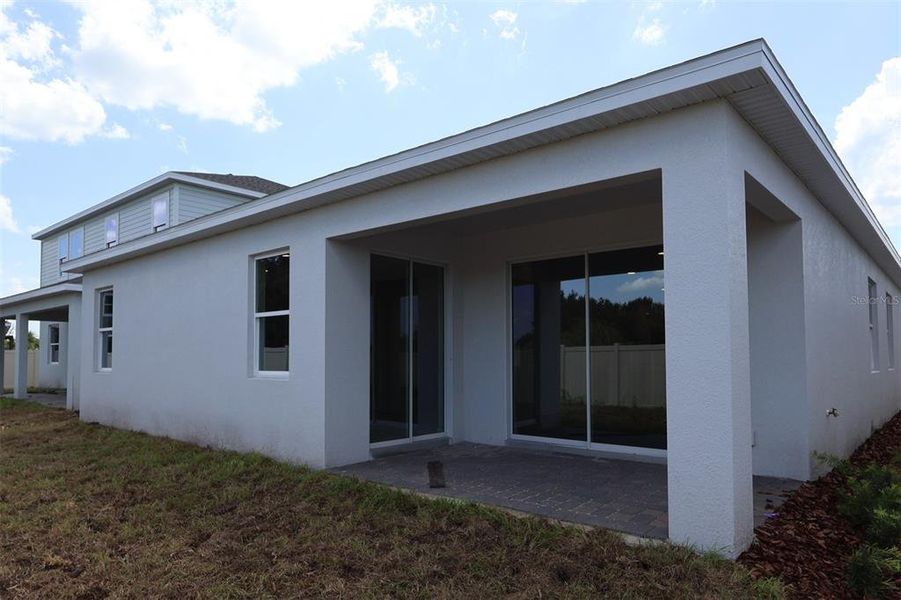 Exterior details and patio area of a home in Bay Lake Farms, St. Cloud (Image 3).