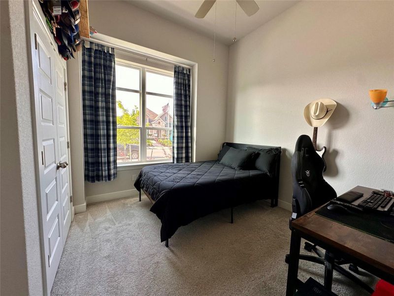 Secondary room at the front of home with access to full bathroom.