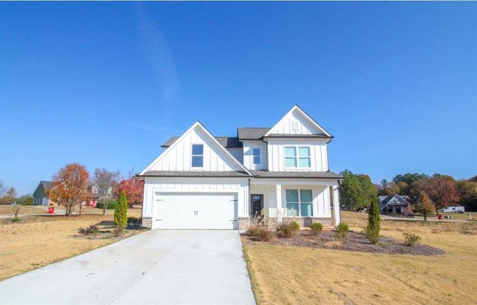 Front exterior of a new home in , Commerce, GA, highlighting curb appeal (Image 1). Front exterior of a new home in , Commerce, GA, highlighting curb appeal (Image 1).