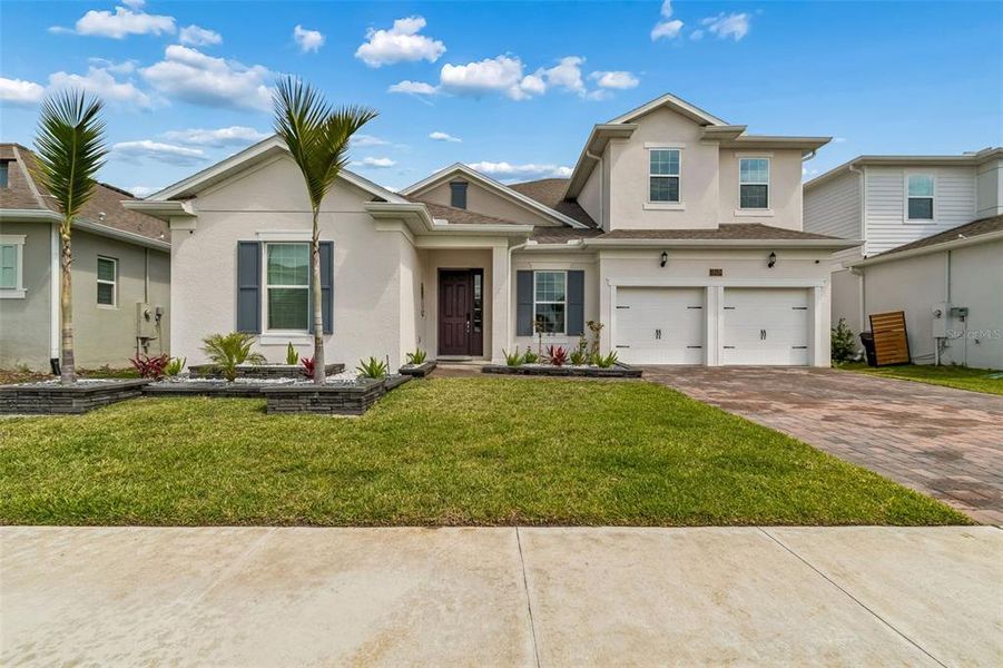Front exterior of a new home in , Orlando, FL, highlighting curb appeal (Image 30).