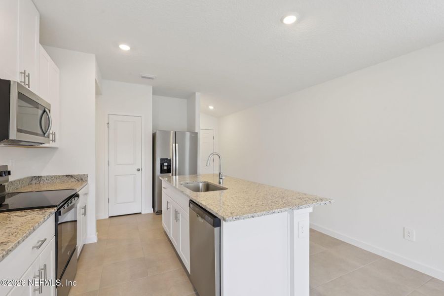 Furnished interior view inside a new home in Flagler Village - Classic Series, Palm Coast (Image 8).