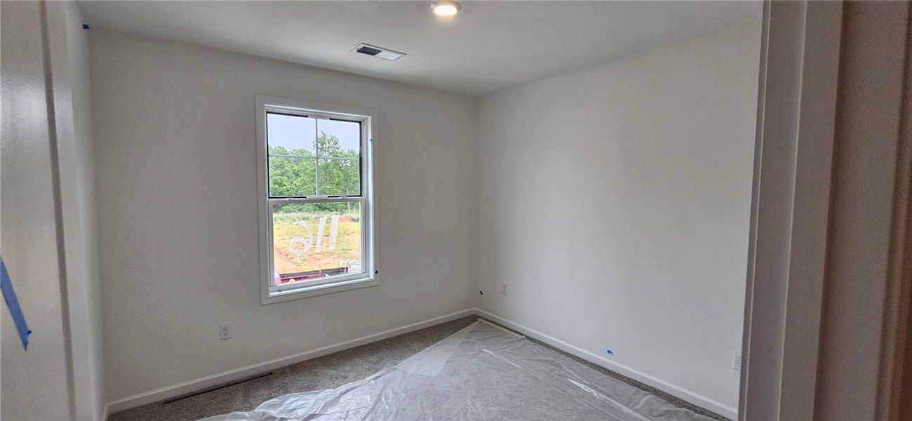 Bright and airy room with window views, offering a
