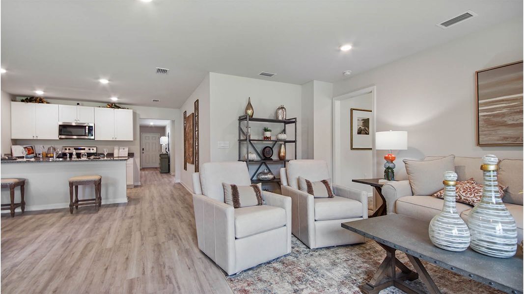 Representative furnished interior of a home built from the Cali by D.R. Horton in Owl's Head East, Freeport (Image 10).