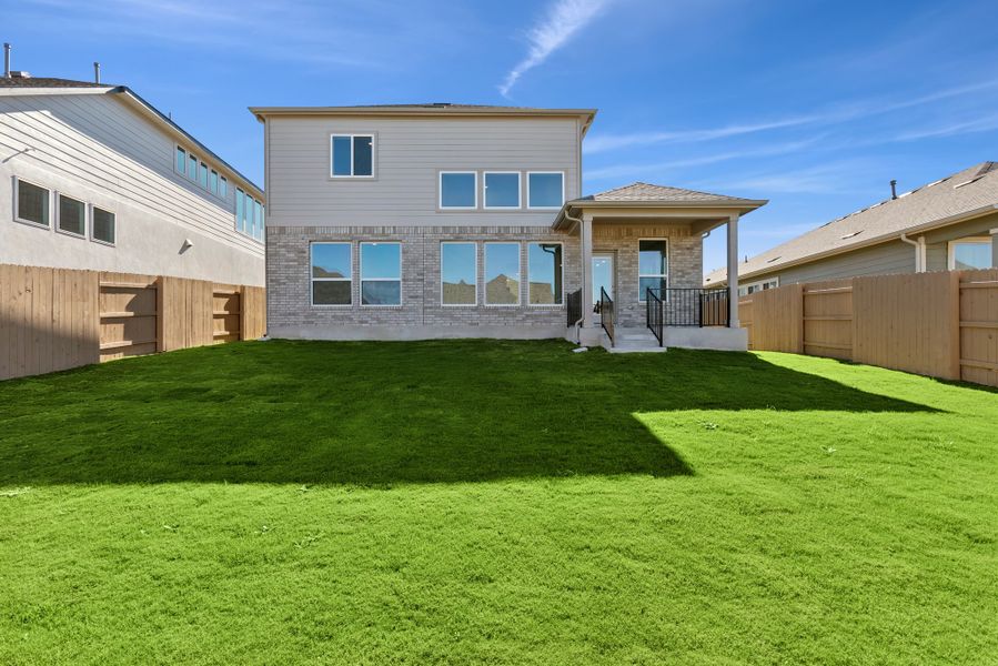 Exterior details and patio area of a home in The Colony, Bastrop (Image 3).