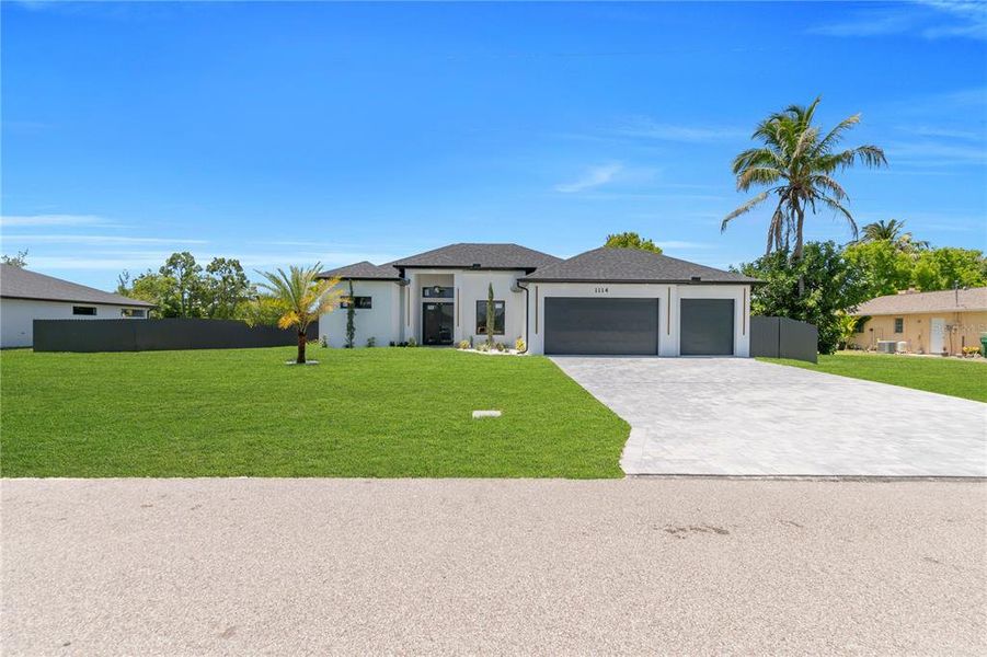 Front exterior of a new home in , Cape Coral, FL, highlighting curb appeal (Image 29).
