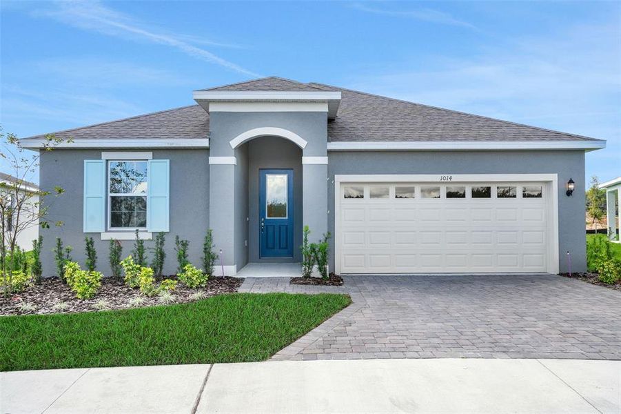 Front exterior of a new home in Reserve at Hammock Oaks, Lady Lake, FL, highlighting curb appeal (Image 18).