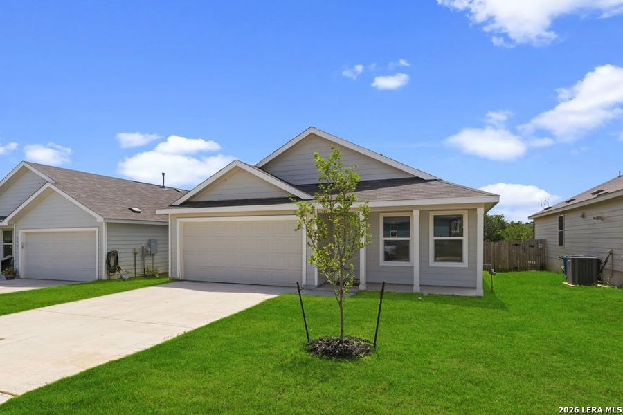 Front exterior of a new home in Lodi Grove, Floresville, TX, highlighting curb appeal (Image 2). Front exterior of a new home in Lodi Grove, Floresville, TX, highlighting curb appeal (Image 2).
