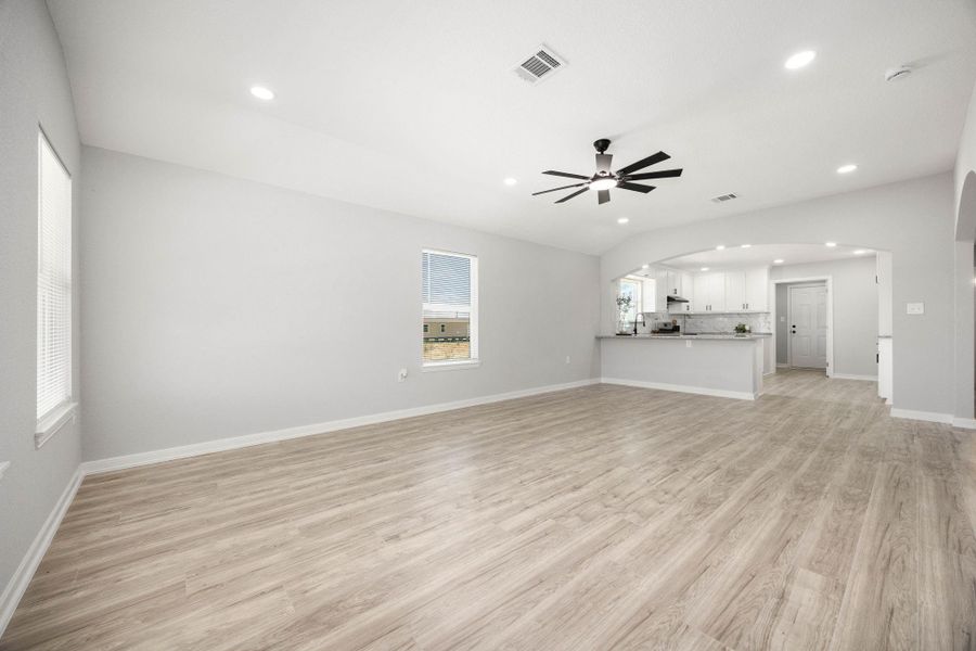 This spacious living room and dining area serves as the heart of the home, featuring an elegant, professionally designed architectural niche complete with custom built-in cabinetry. The thoughtful layout seamlessly blends comfort with functionality, providing both a generous space for entertaining and stylish, storage solutions that enhance the room's aesthetic appeal. The seamless transition between the living and dining zones creates an open, airy atmosphere perfect for hosting guests or enjoying everyday This spacious living room and dining area serves as the heart of the home, featuring an elegant, professionally designed architectural niche complete with custom built-in cabinetry. The thoughtful layout seamlessly blends comfort with functionality, providing both a generous space for entertaining and stylish, storage solutions that enhance the room's aesthetic appeal. The seamless transition between the living and dining zones creates an open, airy atmosphere perfect for hosting guests or enjoying everyday