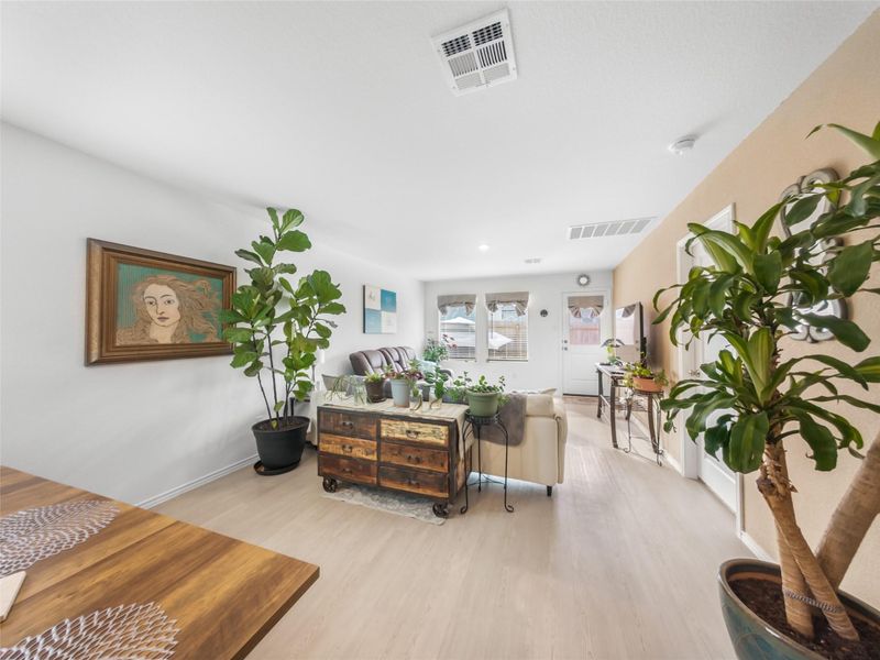 Living room with light wood finished floors and baseboards