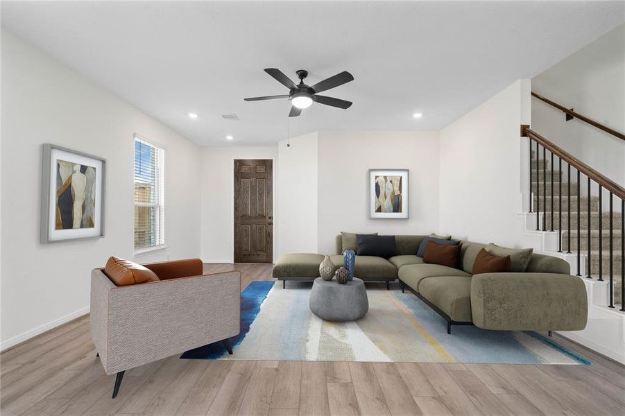 Gather the family and guests together in your lovely family room! Featuring ceiling fan, high ceilings, recessed lighting, custom paint, gorgeous floors and large windows that provide plenty of natural lighting throughout the day.