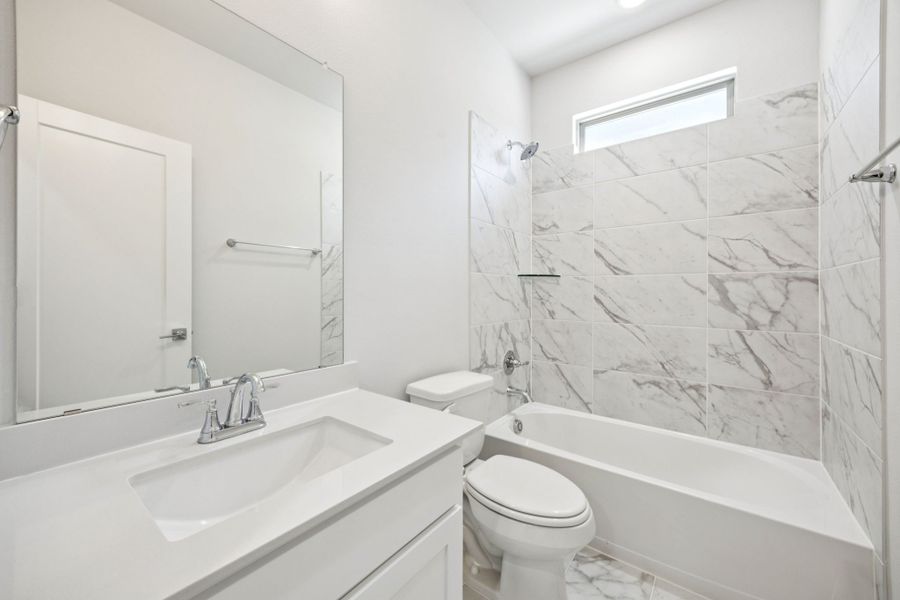 Bathroom in the Wimbledon home plan by Trophy Signature Homes – REPRESENTATIVE PHOTO