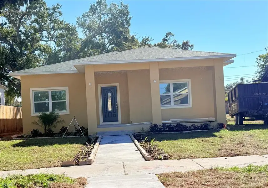 Front exterior of a new home in , St. Petersburg, FL, highlighting curb appeal (Image 1).