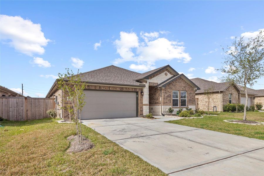 Front exterior of a new home in Wall Street Village, Richmond, TX, highlighting curb appeal (Image 22).