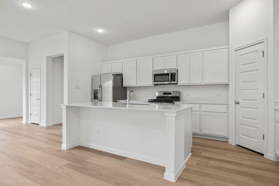 Kitchen in the Quartz home plan by Trophy Signature Homes – REPRESENTATIVE PHOTO Kitchen in the Quartz home plan by Trophy Signature Homes – REPRESENTATIVE PHOTO