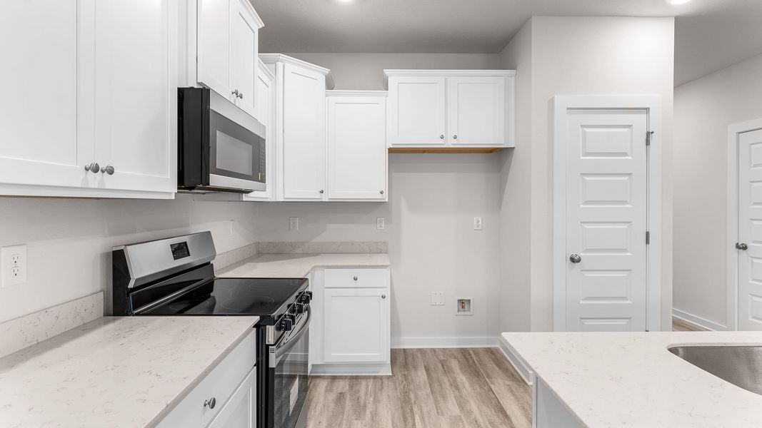 Representative furnished interior of a home built from the Palm Interior by D.R. Horton in Genoa Landing Townhomes, Freeport (Image 7).