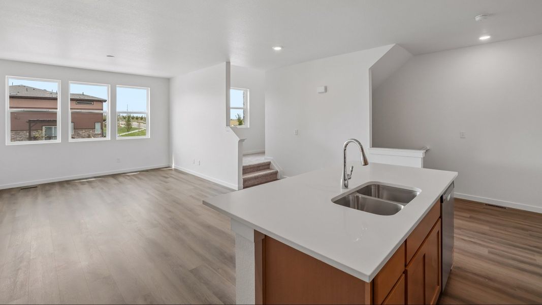 Kitchen with cabinetry, countertops, island, and modern finishes. Kitchen with cabinetry, countertops, island, and modern finishes.