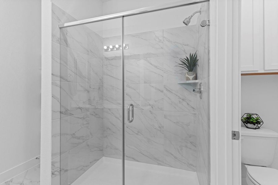 The walk-in super shower features modern tile details and a sleek glass enclosure, giving the space a fresh, spa-like feel you’ll love every day.  Never run out of hot water and enjoy that amazing hot relaxing shower!  We have the tankless water heater!