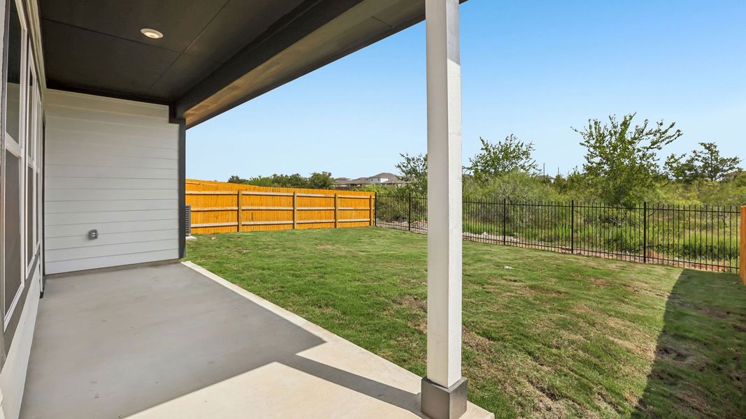 Exterior details and patio area of a home in Prairie Lakes, Buda (Image 3).