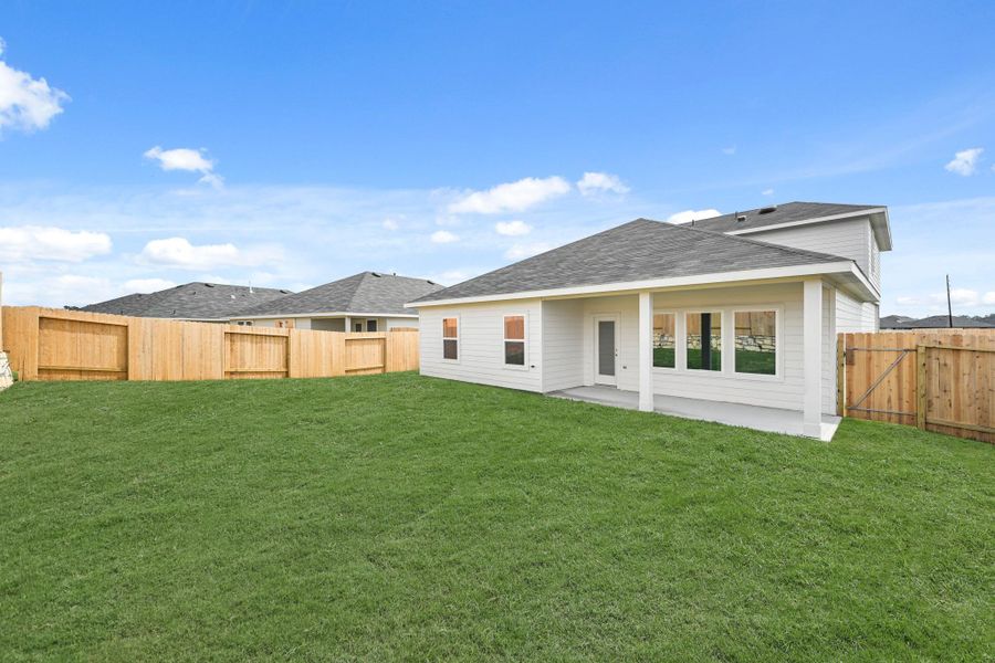 Exterior details and patio area of a home in Grand Pines, Magnolia (Image 3).