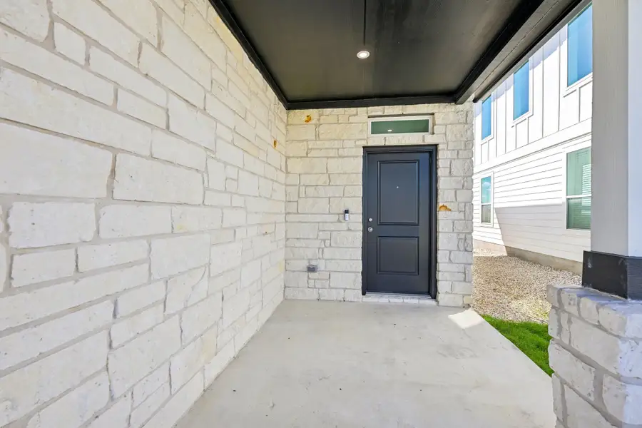 Exterior details and patio area of a home in Porter Country, Buda (Image 2).