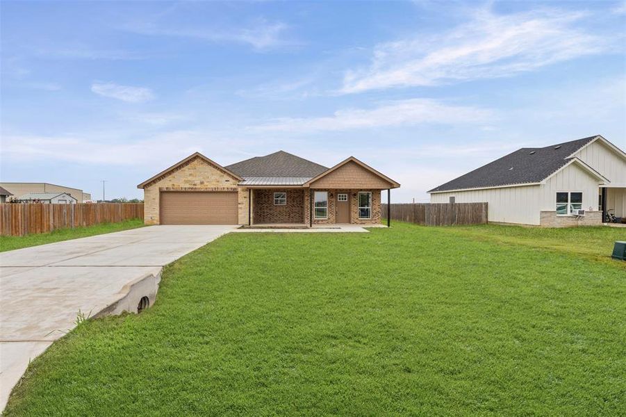 Front exterior of a new home in , Whitney, TX, highlighting curb appeal (Image 18).