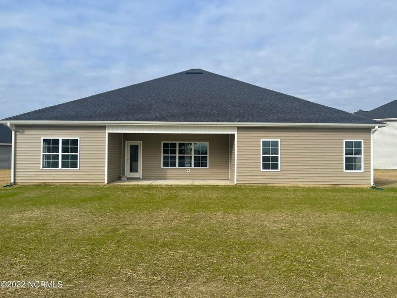 Front exterior of a new home in Summer Place, Grimesland, NC, highlighting curb appeal (Image 2). Front exterior of a new home in Summer Place, Grimesland, NC, highlighting curb appeal (Image 2).