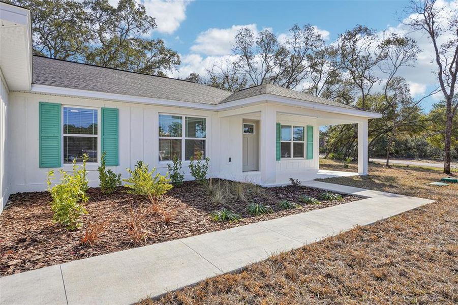 Front exterior of a new home in , Ocala, FL, highlighting curb appeal (Image 31). Front exterior of a new home in , Ocala, FL, highlighting curb appeal (Image 31).