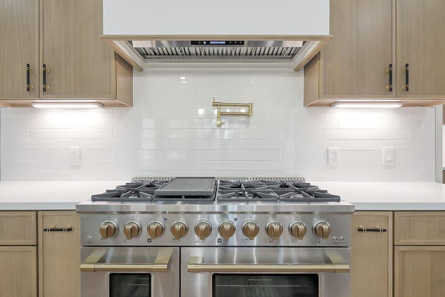 Cooking is easy with the six burner range with double oven complete with conventient pot filler.