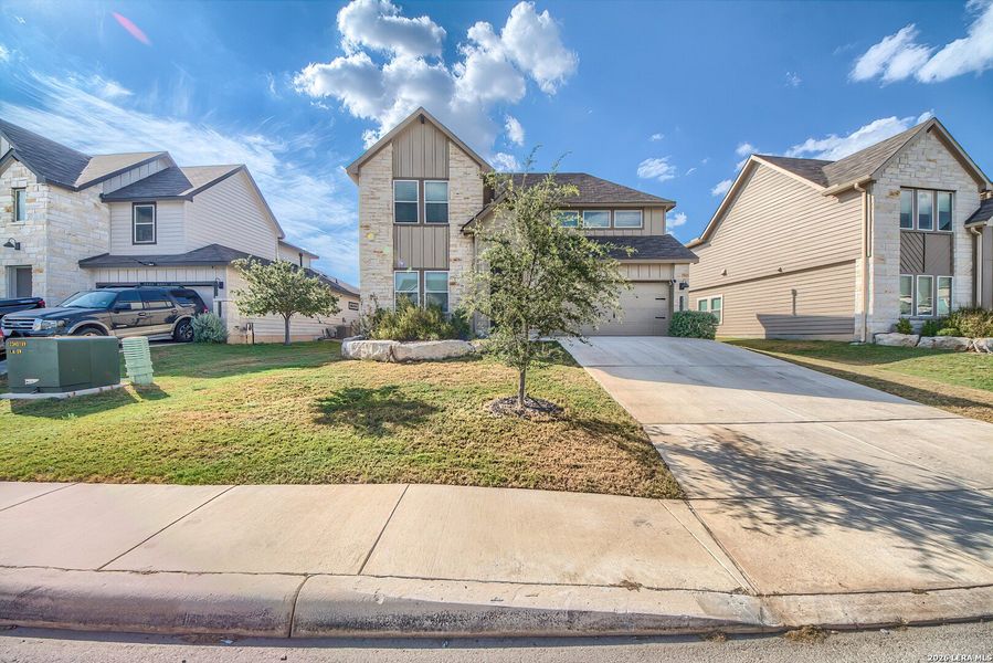 Front exterior of a new home in Brookstone Creek, San Antonio, TX, highlighting curb appeal (Image 22).