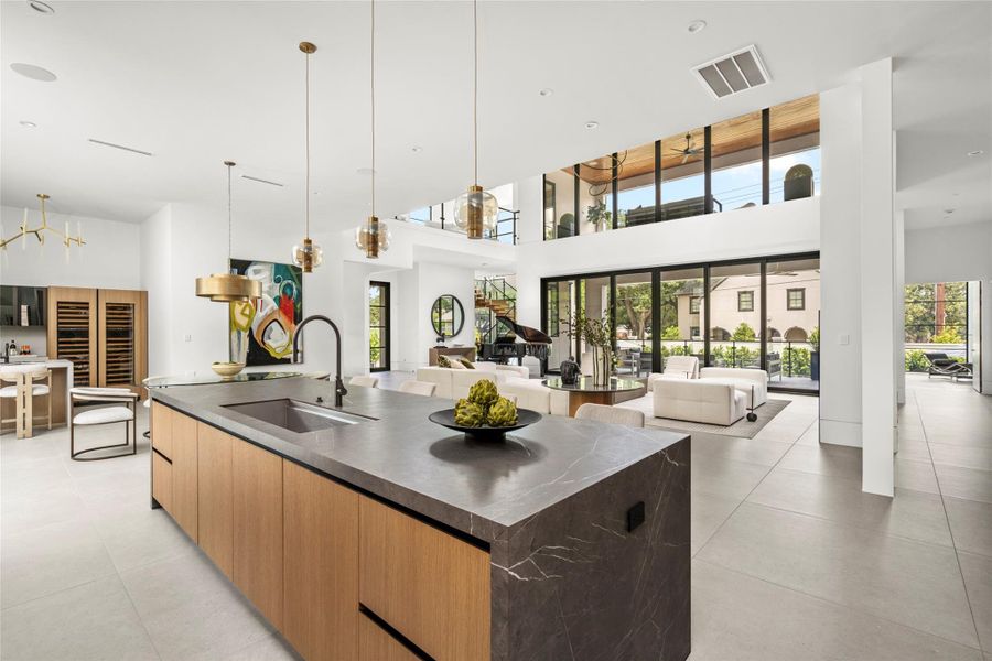 Sunlight fills the living area while expansive sliding doors create a perfect connection to the resort-style backyard. Sunlight fills the living area while expansive sliding doors create a perfect connection to the resort-style backyard.
