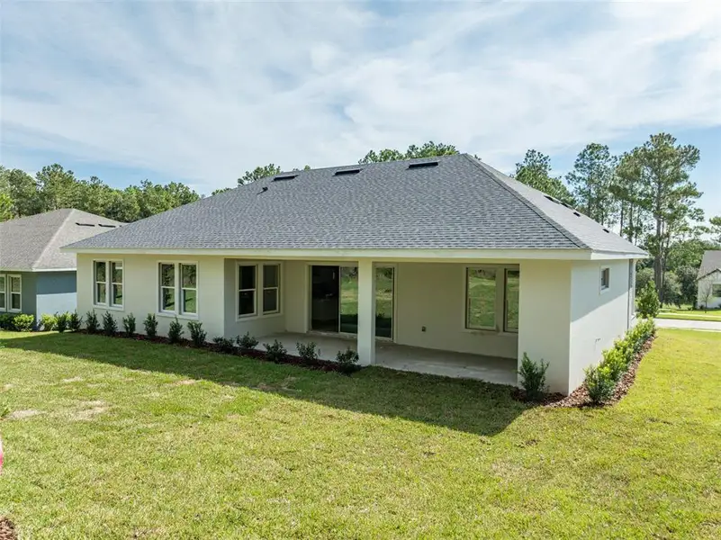 Exterior details and patio area of a home in Southern Hills Plantation, Brooksville (Image 3).
