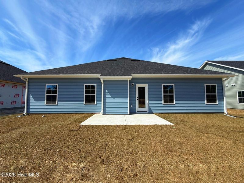 Exterior details and patio area of a home in Wood Creek Landing, Leland (Image 3).