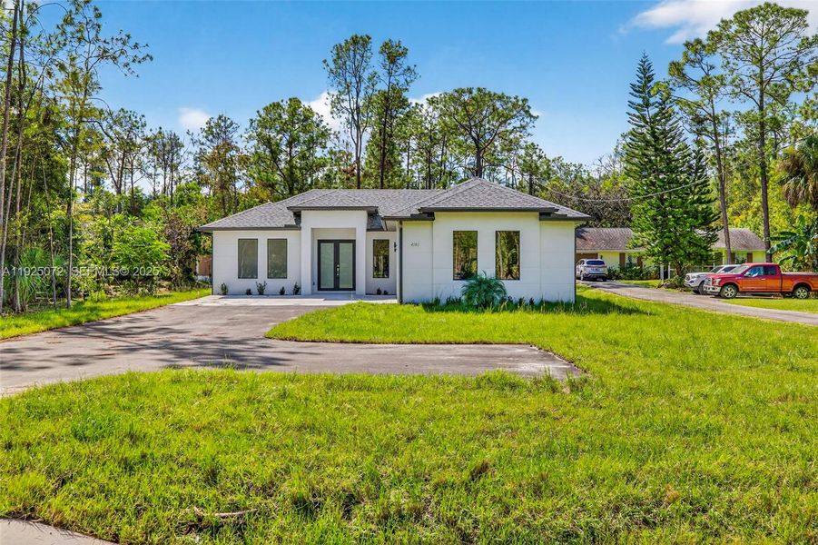 Front exterior of a new home in , Naples, FL, highlighting curb appeal (Image 2).