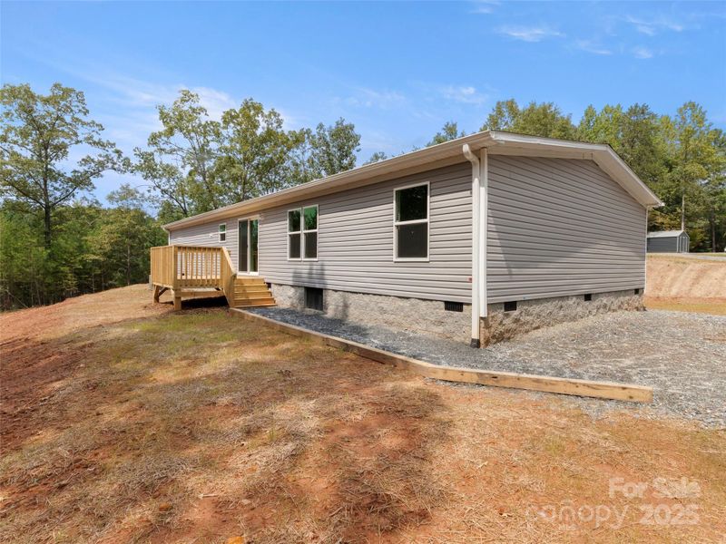 Front exterior of a new home in , Mill Spring, NC, highlighting curb appeal (Image 14). Front exterior of a new home in , Mill Spring, NC, highlighting curb appeal (Image 14).