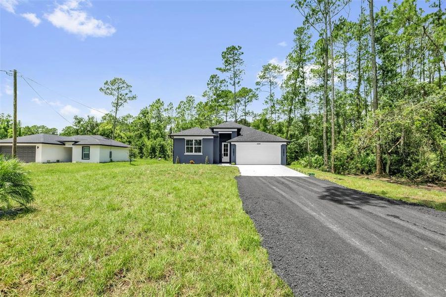 Front exterior of a new home in , Deland, FL, highlighting curb appeal (Image 21).