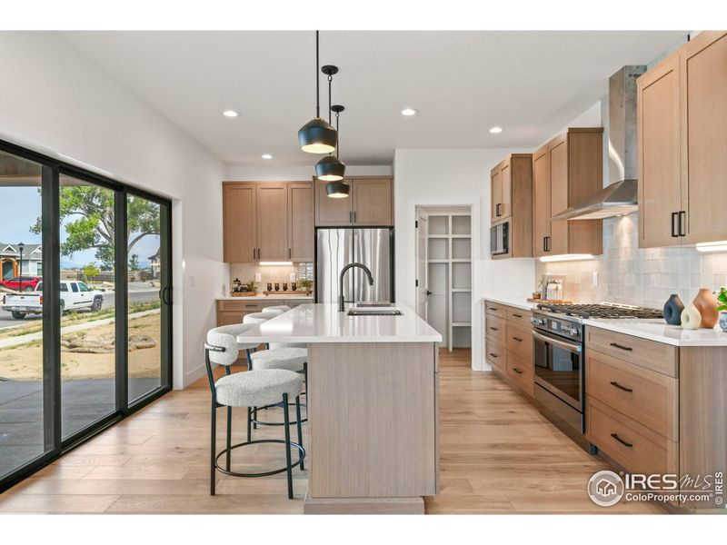 Large eat in island with direct access to the covered patio