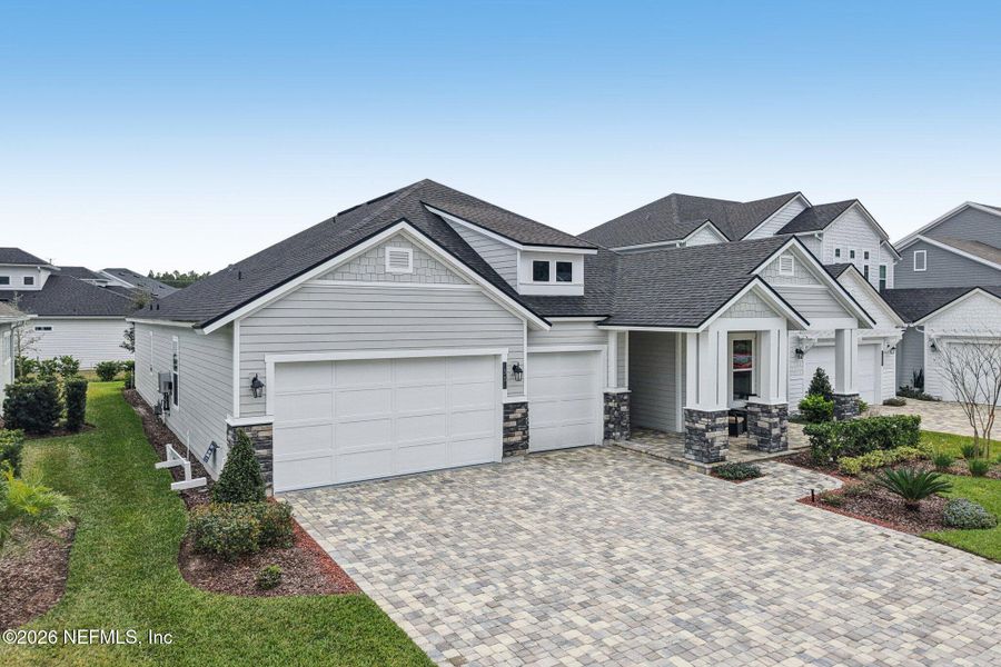 Front exterior of a new home in Middlebourne, St. Johns, FL, highlighting curb appeal (Image 2).