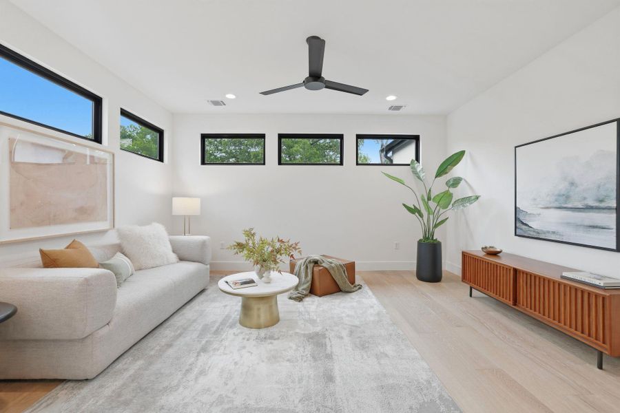 Bright living area with light wood-finish flooring
