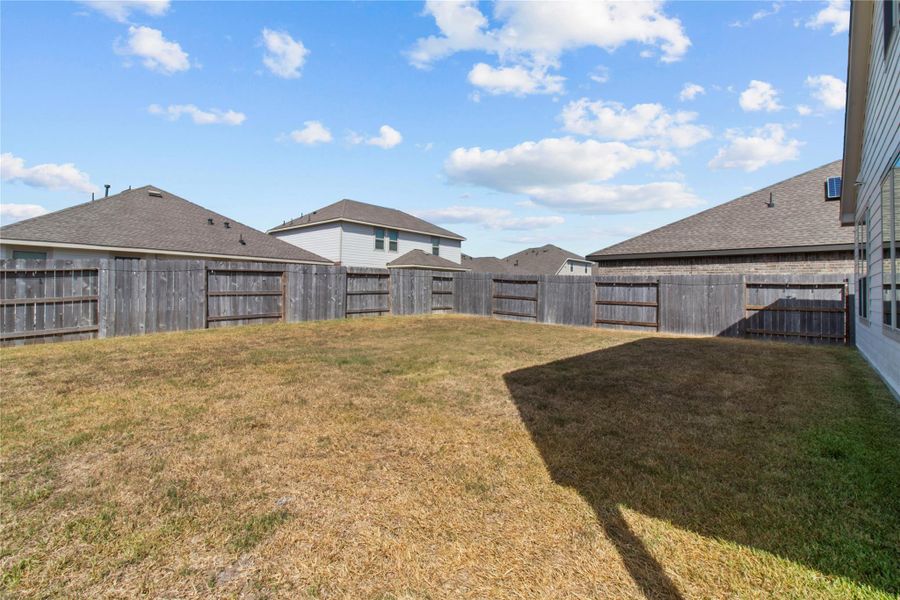 Exterior details and patio area of a home in Tavola: Wildflower II Collection, New Caney (Image 2).