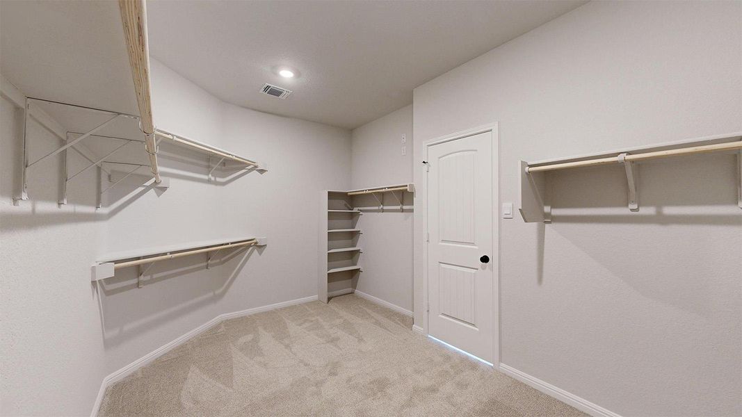 Walk in closet with light carpet Walk in closet with light carpet