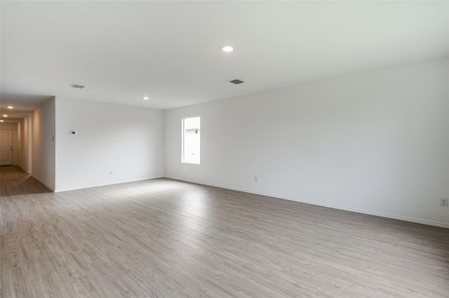 Unfurnished room with light wood-type flooring