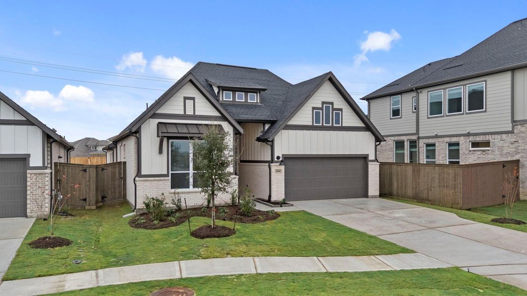 Front exterior of a new home in Blue Heron, Mont Belvieu, TX, highlighting curb appeal (Image 18).