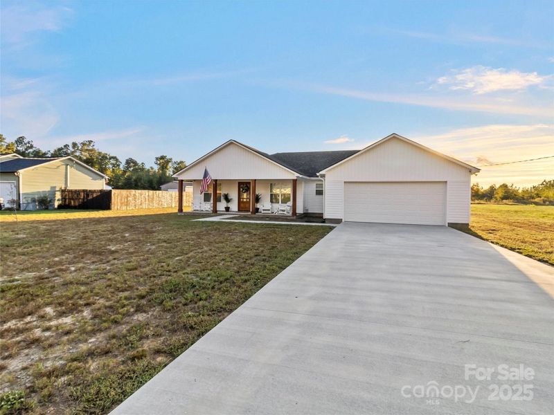 Nice long driveway in front to the large 2 car garage