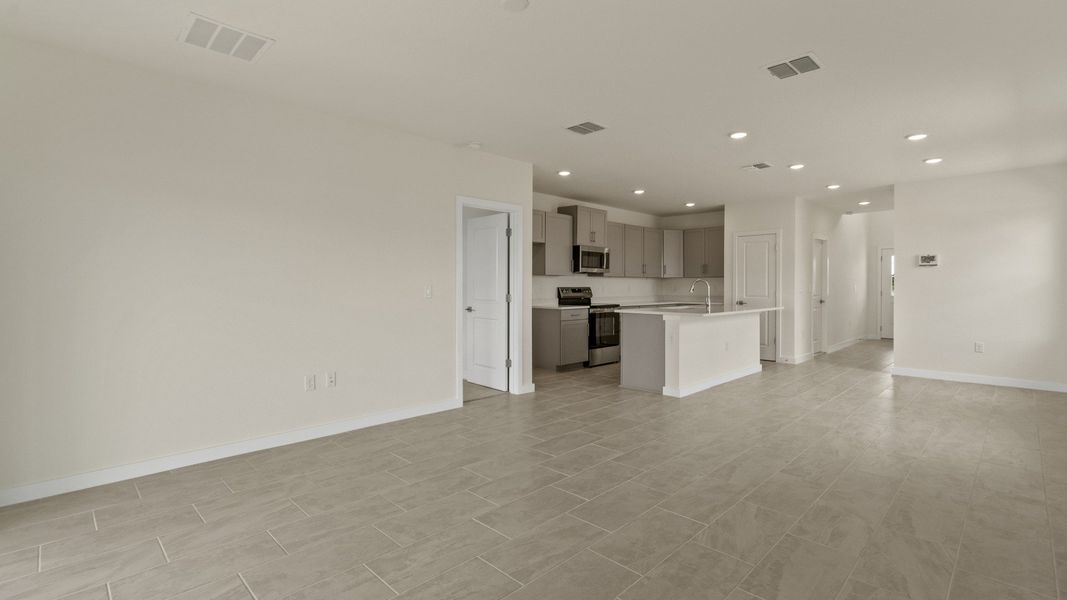 The Naples Living Area and Kitchen with large Island Quick Move-In Home at Willowbrook North by DRB Homes in Winter Haven, FL The Naples Living Area and Kitchen with large Island Quick Move-In Home at Willowbrook North by DRB Homes in Winter Haven, FL
