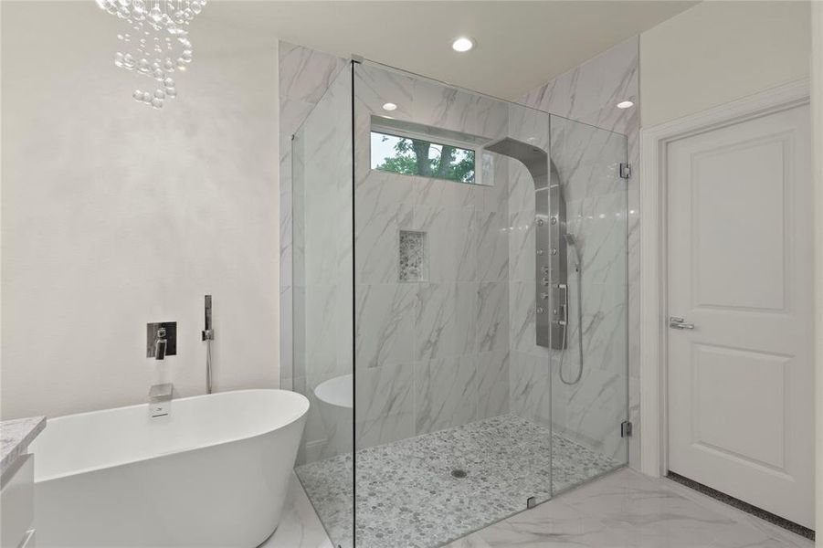Freestanding soaking tub with floor-mounted faucet Freestanding soaking tub with floor-mounted faucet