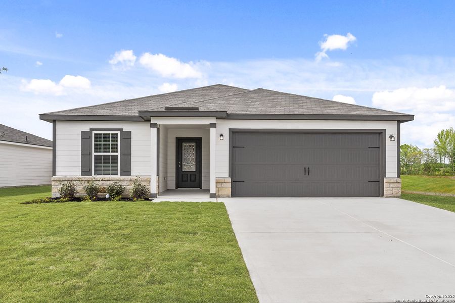Front exterior of a new home in Rosewood Estates, Lytle, TX, highlighting curb appeal (Image 1).