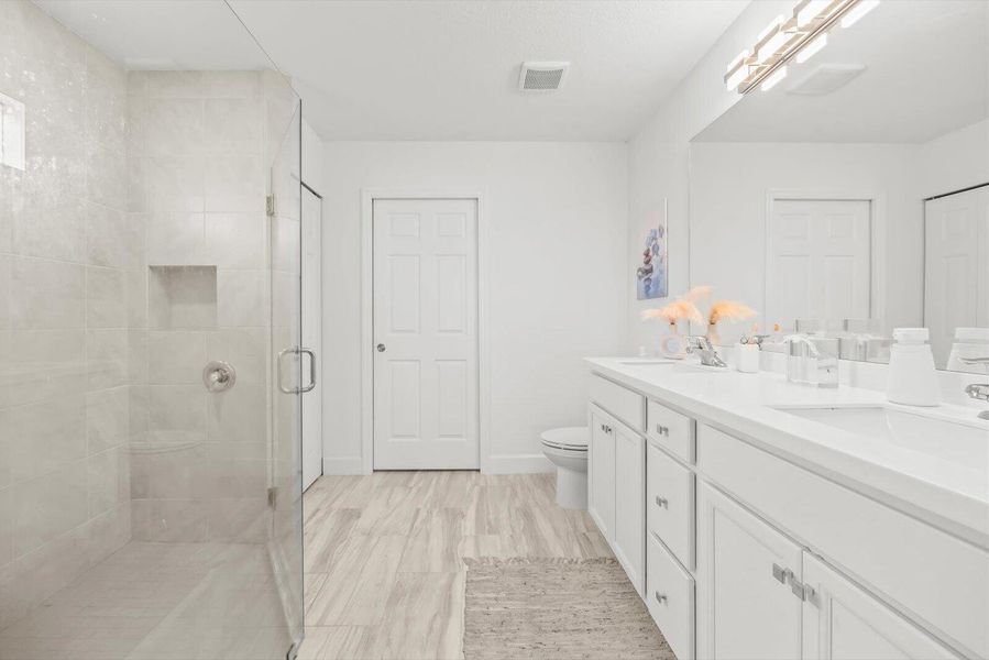 Master En-Suite Highlighting the Walk-In Closet and Space-Saving Pocket Door