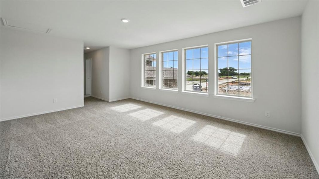 Spare room with light colored carpet and recessed lighting