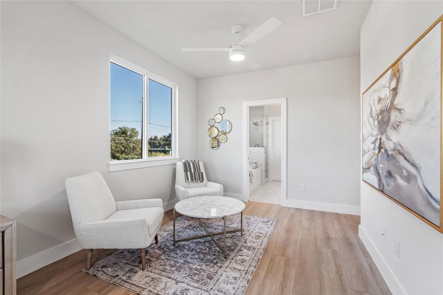 The primary suite includes a cozy sitting area that's perfect for unwinding with a book or morning coffee, leading seamlessly into the spa-inspired ensuite bath. The primary suite includes a cozy sitting area that's perfect for unwinding with a book or morning coffee, leading seamlessly into the spa-inspired ensuite bath.